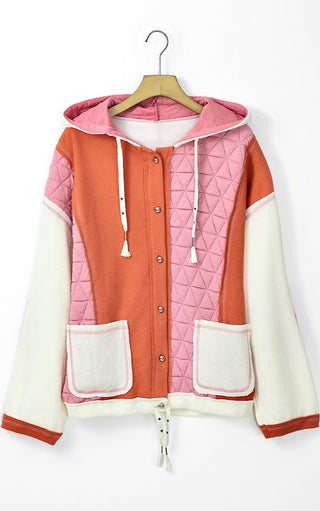 Charleston Charm Jacket in apricot and ivory waffle knit with pink quilted contrast on a wooden hanger