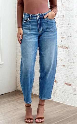 Woman wearing Arabella Soft Barrel Cut Jeans by Judy Blue, full front view showing high-rise fit and soft barrel leg with a brown long sleeve top.