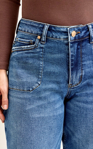 Close-up of Judy blue barrel jeans with a plain background