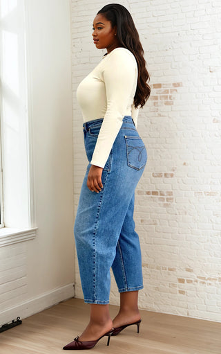 Side view of plus-size model in Arabella Soft Barrel Cut Jeans by Judy Blue highlighting flattering barrel cut silhouette.