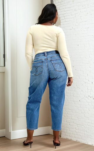 Back view of plus-size model in Arabella Soft Barrel Cut Jeans by Judy Blue highlighting flattering barrel cut silhouette.