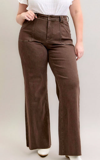 Curvy model close-up in Judy Blue Chestnut Brown Wide Leg Jeans showing flattering fit and patch pockets.