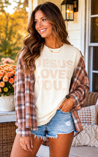 Cream Comfort Colors Jesus Loves You graphic tee styled with a plaid flannel and denim shorts for fall