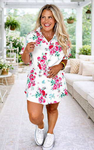 Woman wearing a floral skort set with a white outdoor setting