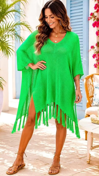 Video of tan brunette model wearing green crochet swimsuit coverup with fringe trim.