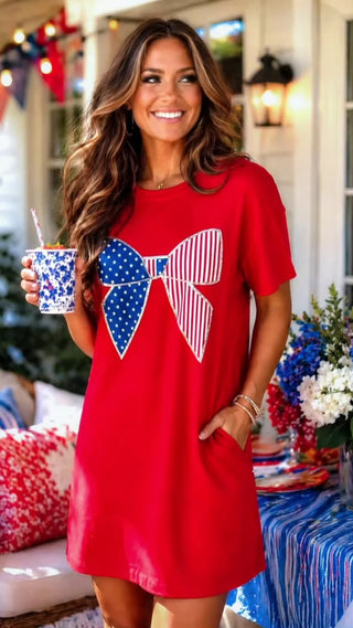 Video of red dress with Stars and Stripes bow on a brunette model with a patriotic background